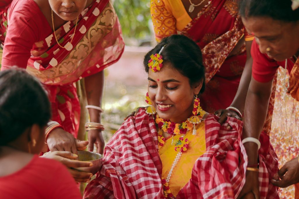 Bride being prepared by women of her family before the ceremony