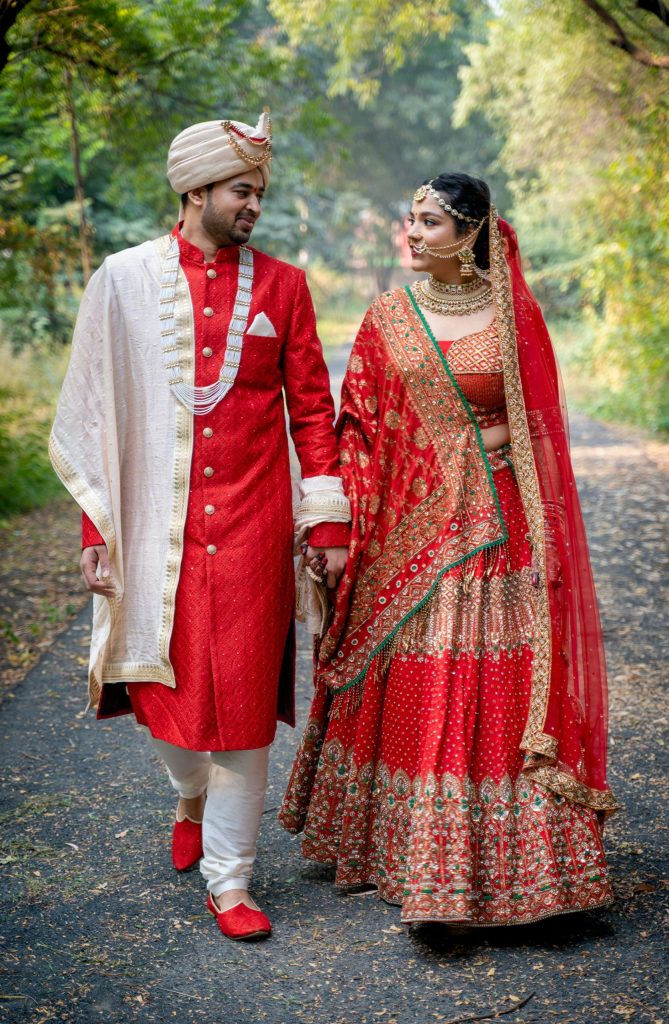 Bride and groom walking down a path together