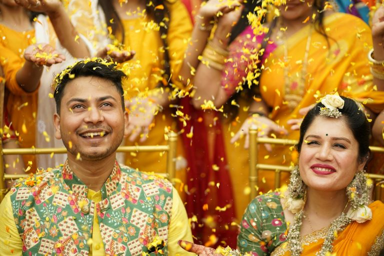 Couple standing in front of their wedding guests