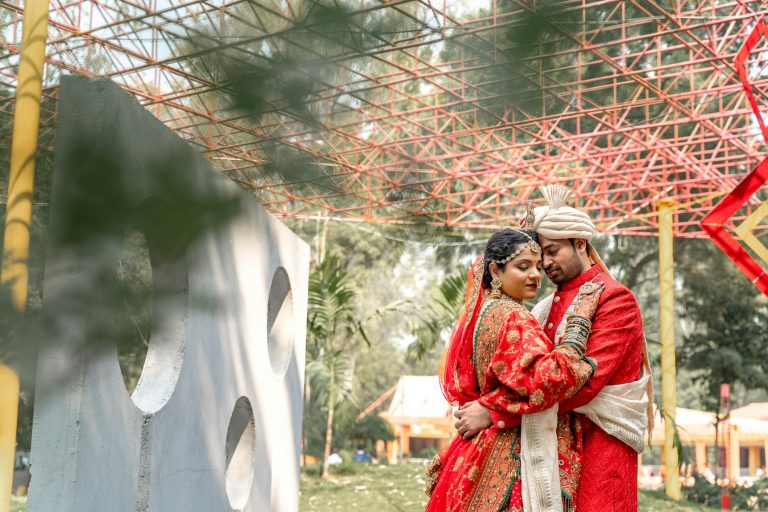 Couple standing next to each other outdoors