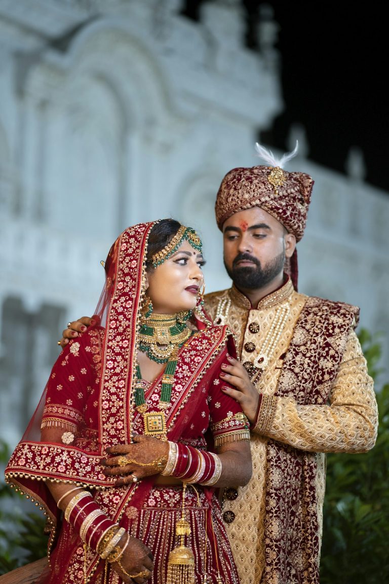 Couple in traditional attire posing for a portrait