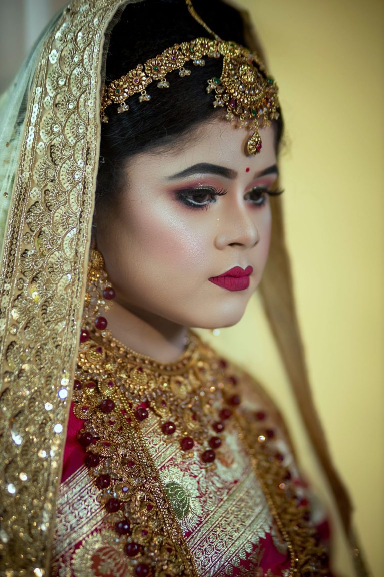 South Asian bride in bridal attire with intricate jewellery