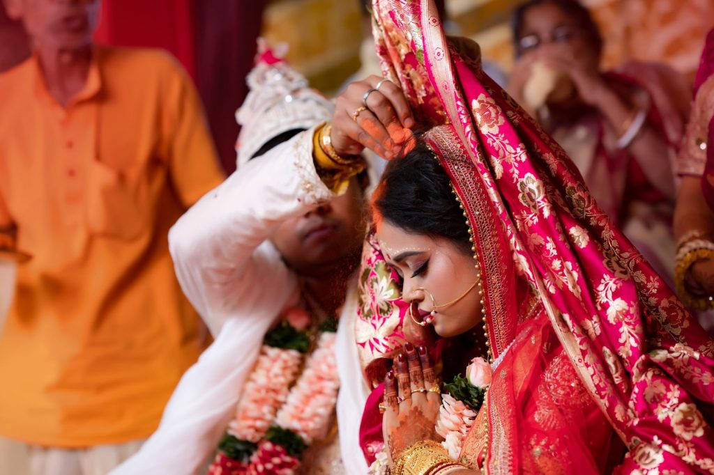 Bride and groom performing traditional wedding rituals