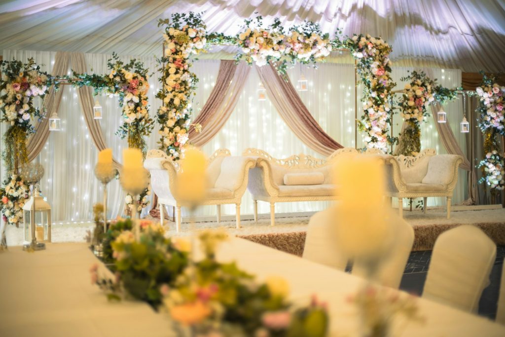 Event stage with floral decor and seating